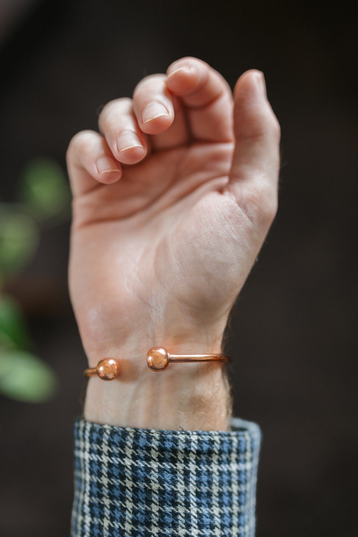 Kopero Copper Bracelet Round, on the wrist, with the two small balls at the ends visible