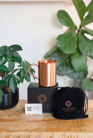 Kopero Copper Mug Smooth, with the black branded box, the velvet pouch and the thank-you card