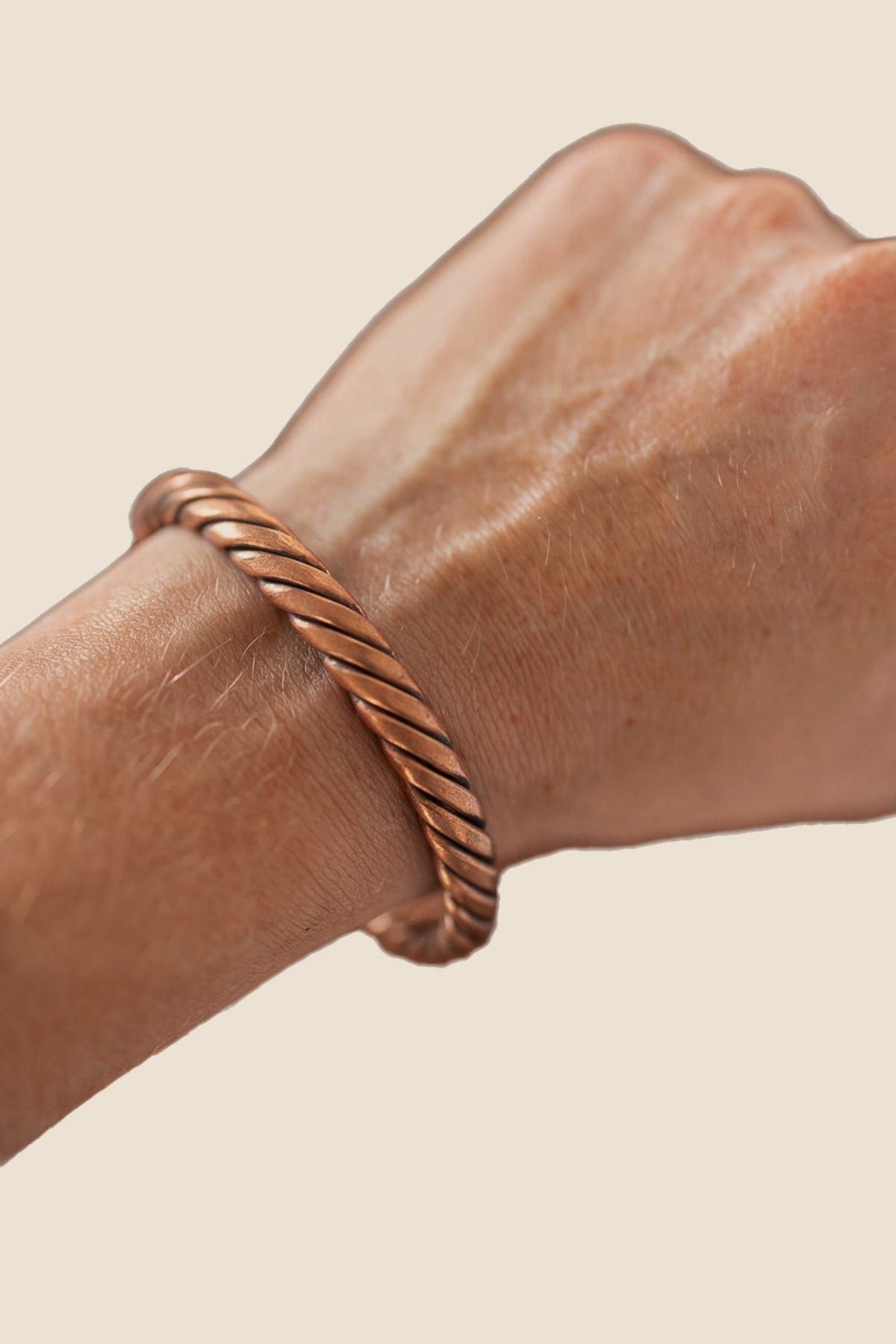 Kopero Copper Bracelet Twisted, on the wrist, product photo on a white background